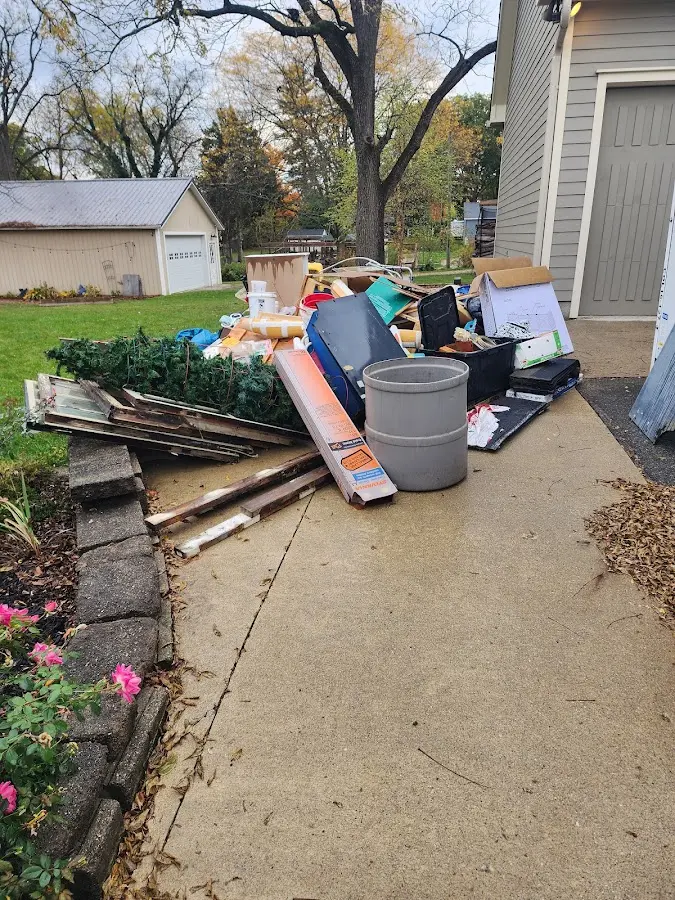 Dumpster being loaded with debris for 10 Yard Dumpster Rental in Shepherdsville